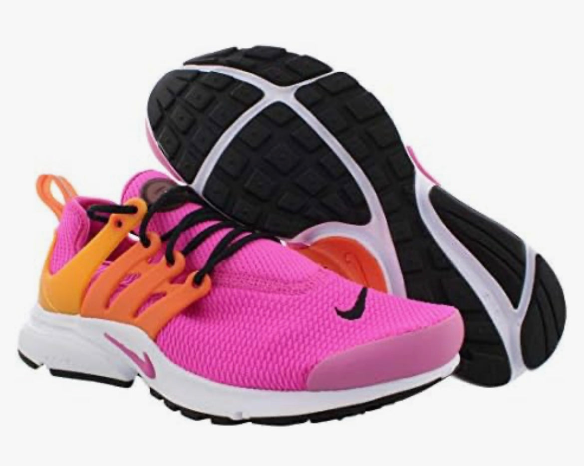 A pair of Nike Air Presto Sunset Pulse sneakers in pink, black, and white colors with a visible sole and lace-up closure.