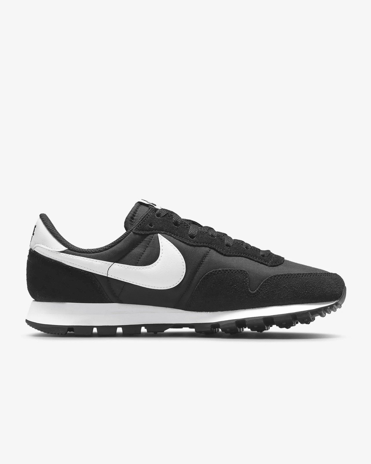 A pair of black Nike Air Pegassus sneakers with a white sole and suede accents.