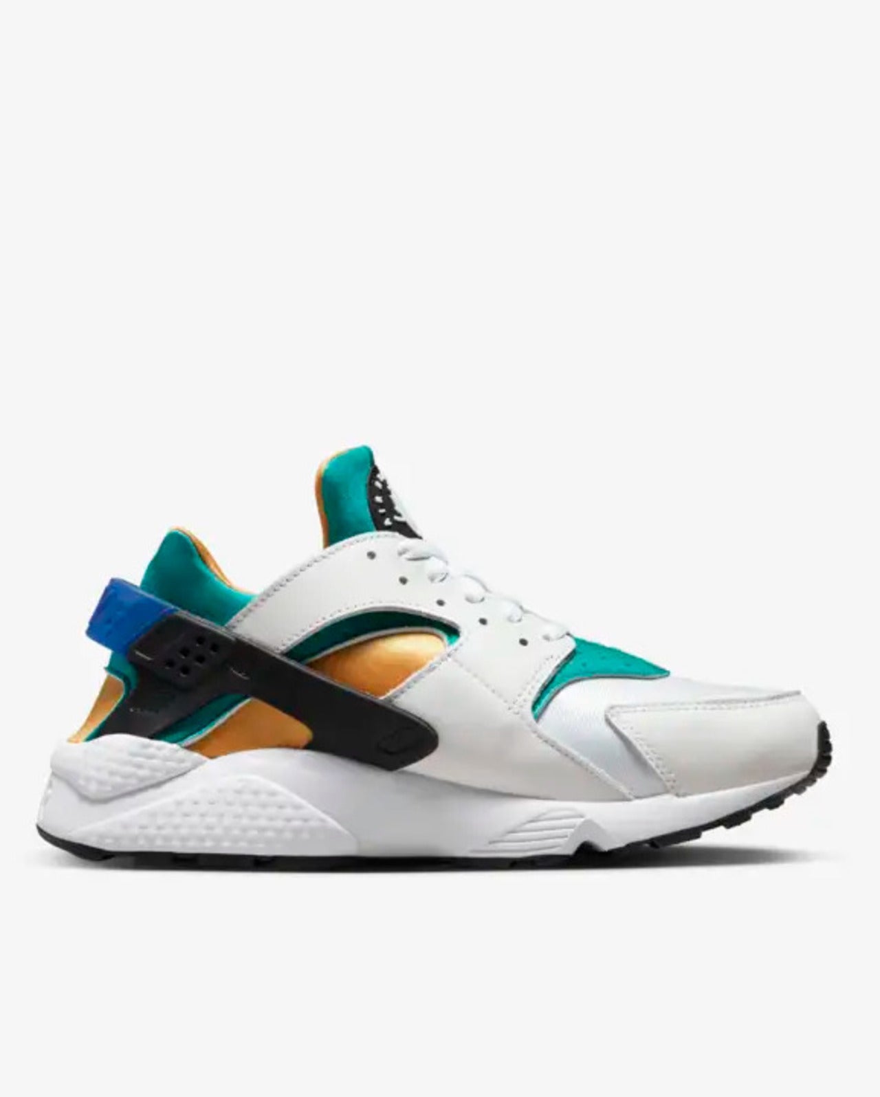 A pair of Nike Air Huarache sneakers with white, emerald, and black colors on the upper, black heel cage, blue rear clips, white midsole, and black rubber outsole.
