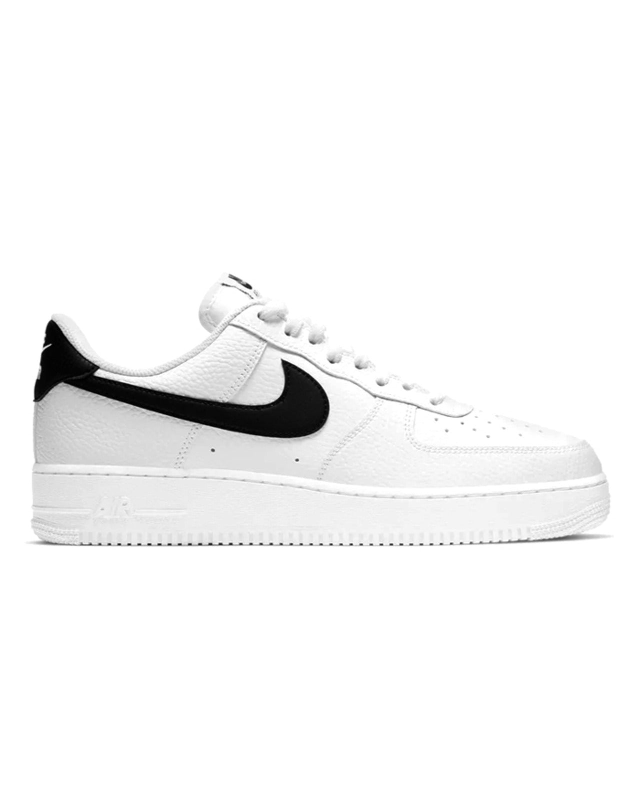 Nike Air Force 1 '07 white sneakers with black Nike logo on the side.
