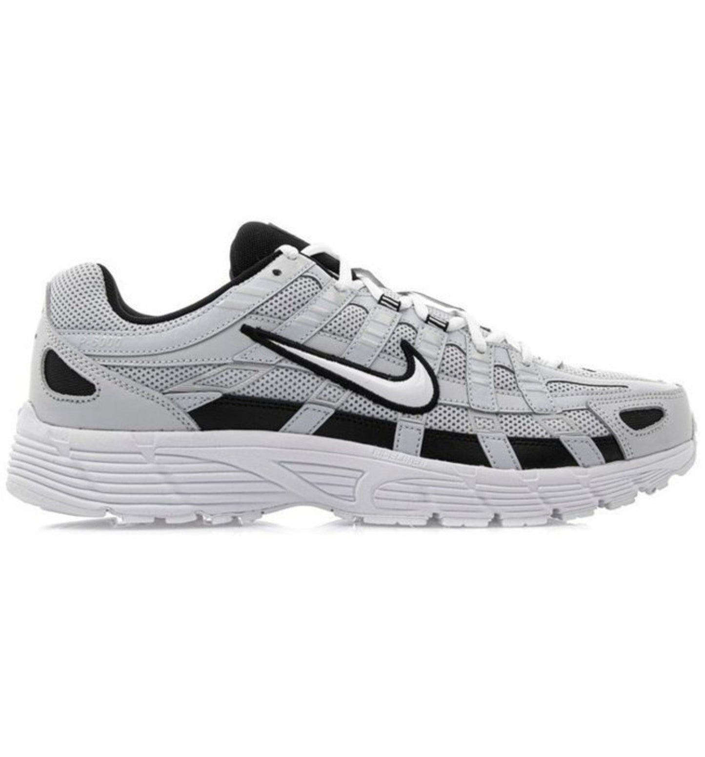 Nike P-6000 Sneakers in gray, black, and white color scheme, featuring a low-top design with lace-up closure and the Nike logo on the side.