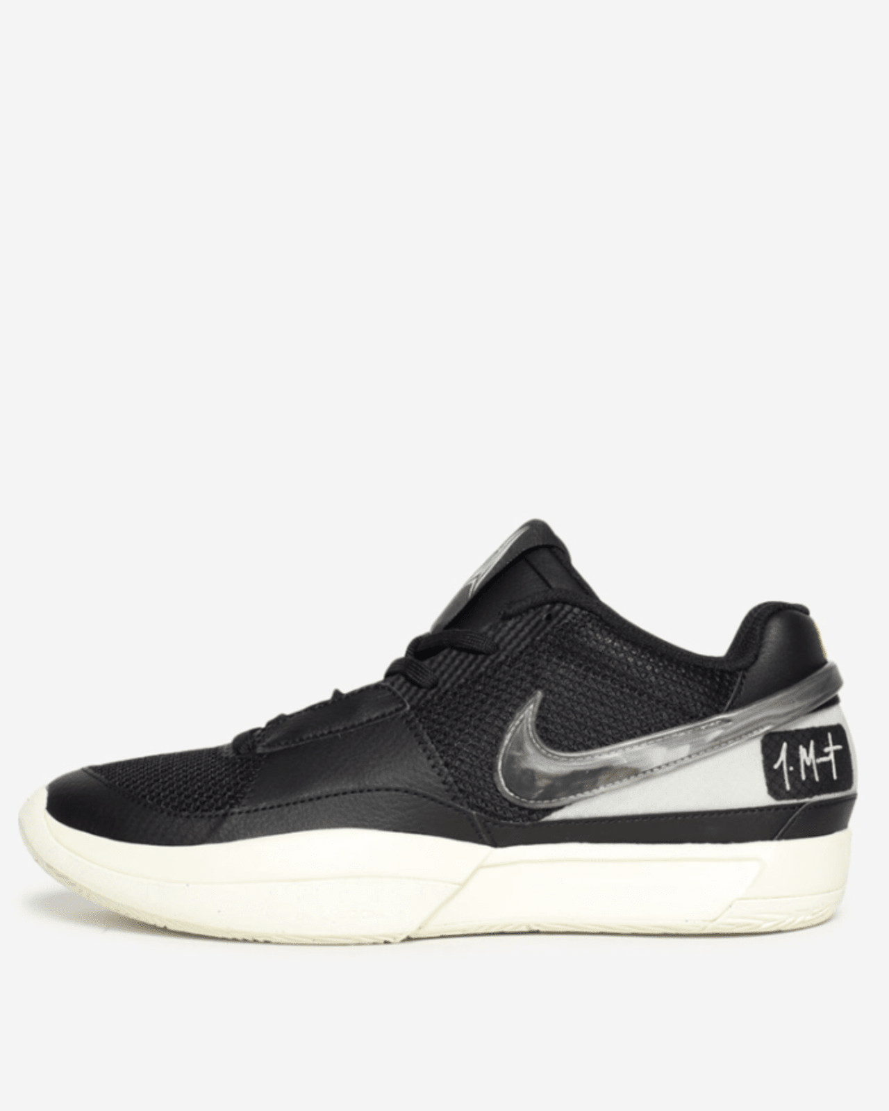 A pair of Nike Ja Morant 1 sneakers featuring a black and white color scheme, with a prominent 'JM' logo on the heel and a Swoosh logo in TPU.