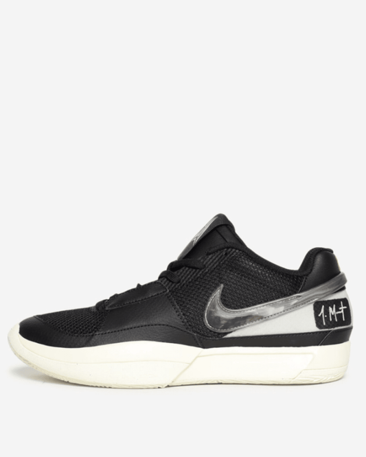 A pair of Nike Ja Morant 1 sneakers featuring a black and white color scheme, with a prominent 'JM' logo on the heel and a Swoosh logo in TPU.